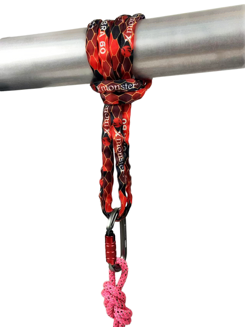 Xmonster Cobra 60 sling. In use image over a pipe, clipped into a carabiner and a rope.  Used for rope access, technical rescue or rock climbing.
